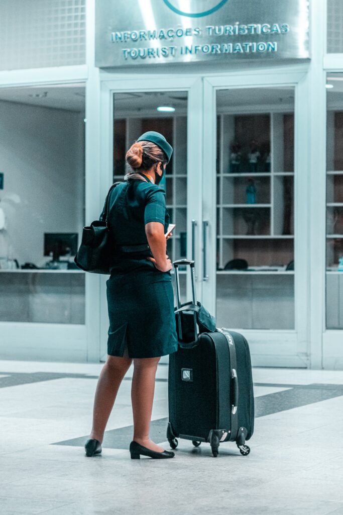 Flight attendant with luggage