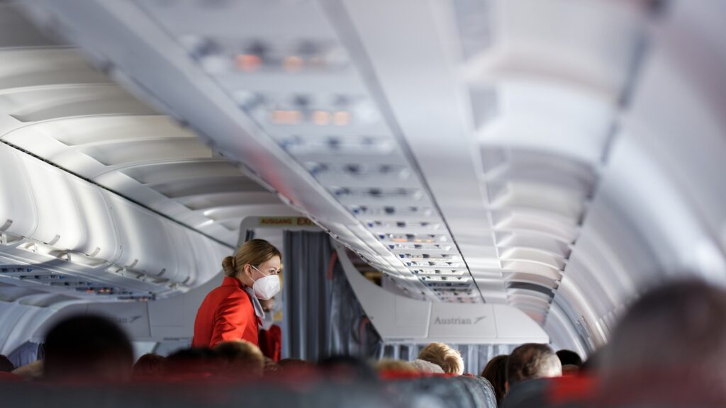 Flight attendant working in caben